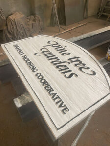 Kavips Coop Gardens sign after painting