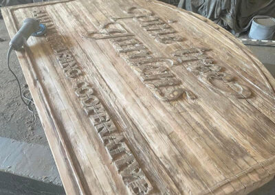 Kavips Coop Gardens sign sandblasted before painting