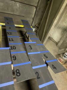 Kavips Sandblasting numbered sheets in shop