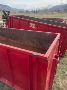 Kavips Sandblasting sandblasted red rolloff bins