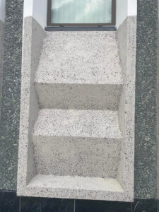 Kavips concrete decoration below window before painting
